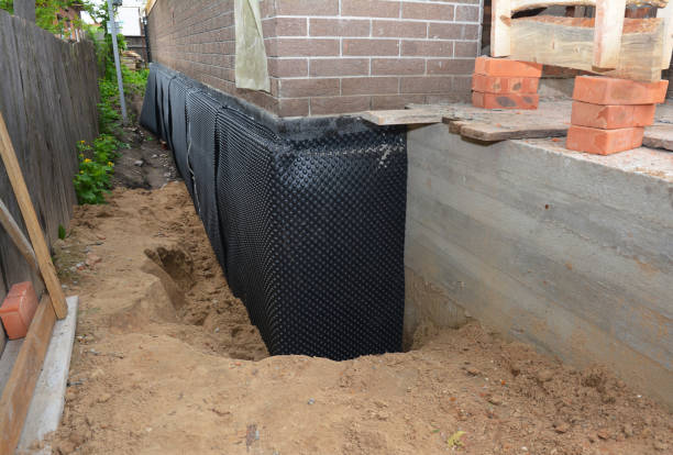 Happy homeowners after waterproofing job in Grand Blanc